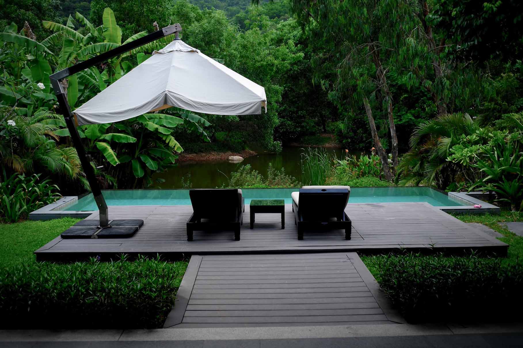 garden-pool-umbrella-deck-chair-trees